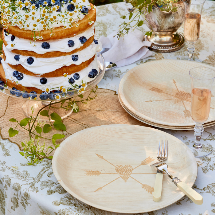 maaterra compostable palm leaf plates with crossed arrows design on a wedding table.