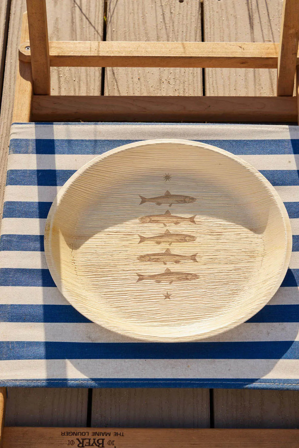 maaterra compostable palm leaf plate with stacked fish design.