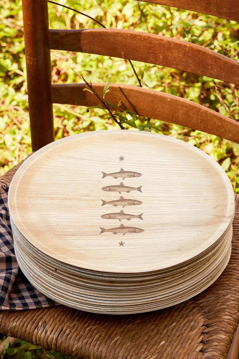 maaterra compostable palm leaf plate with stacked fish design.