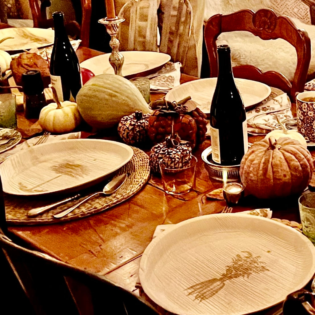 maaterra compostable palm leaf plates on a holiday table setting.