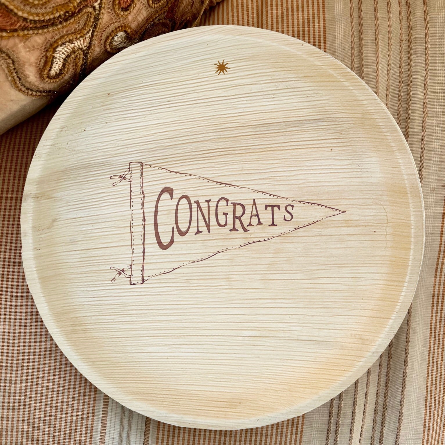maaterra's compostable palm leaf plate with Congrats design.