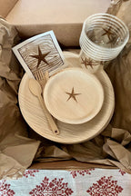 opened maaterra product packaging inside a cardboard box with brown paper.