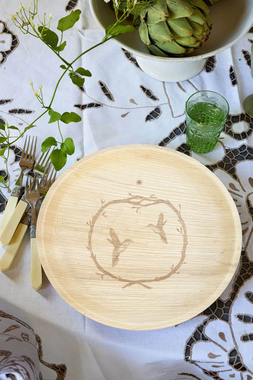 maaterra compostable palm leaf plate with hummingbird wreath design.