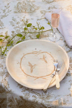 maaterra compostable palm leaf plate with hummingbird wreath design.