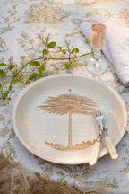 maaterra compostable palm leaf plate with shade tree design.
