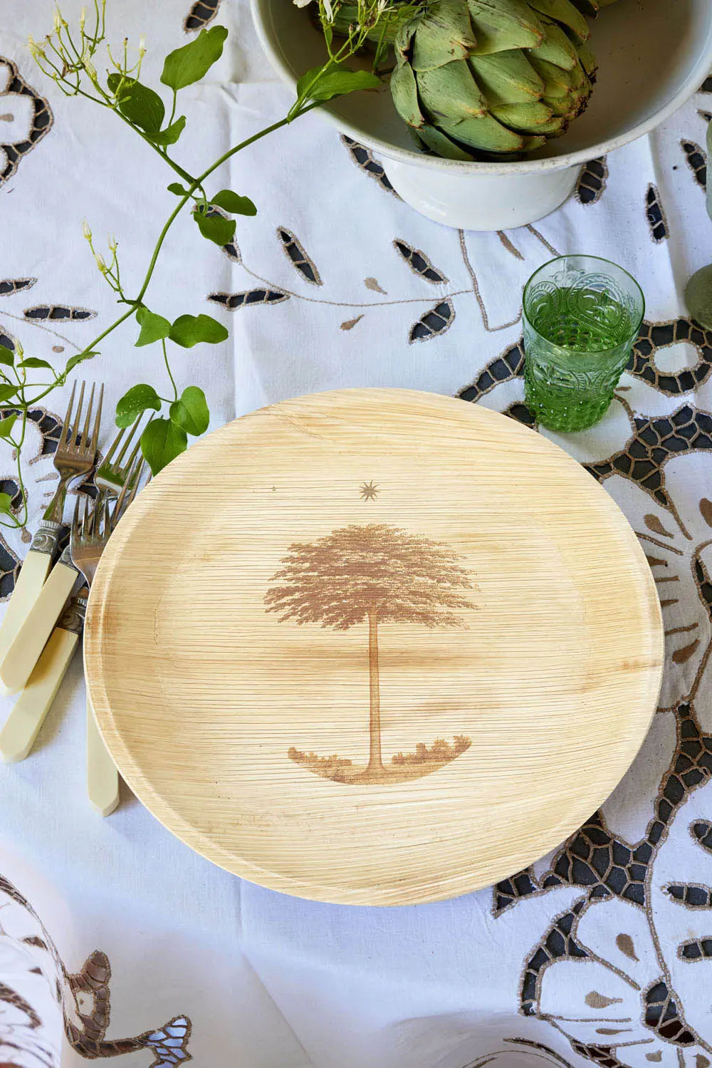 maaterra compostable palm leaf plate with shade tree design.