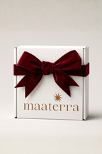 White gift box with a red velvet bow and 'maaterra' branding on a light gray background