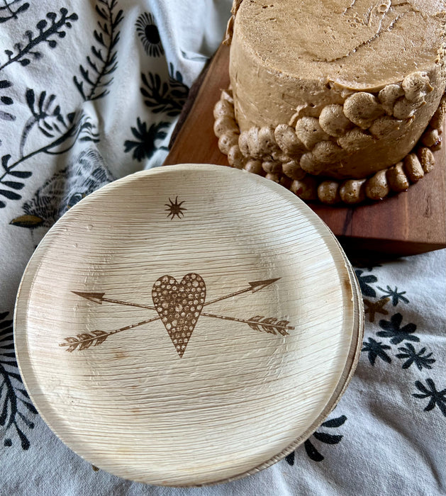 maaterra compostable palm leaf plate with stone heart design.