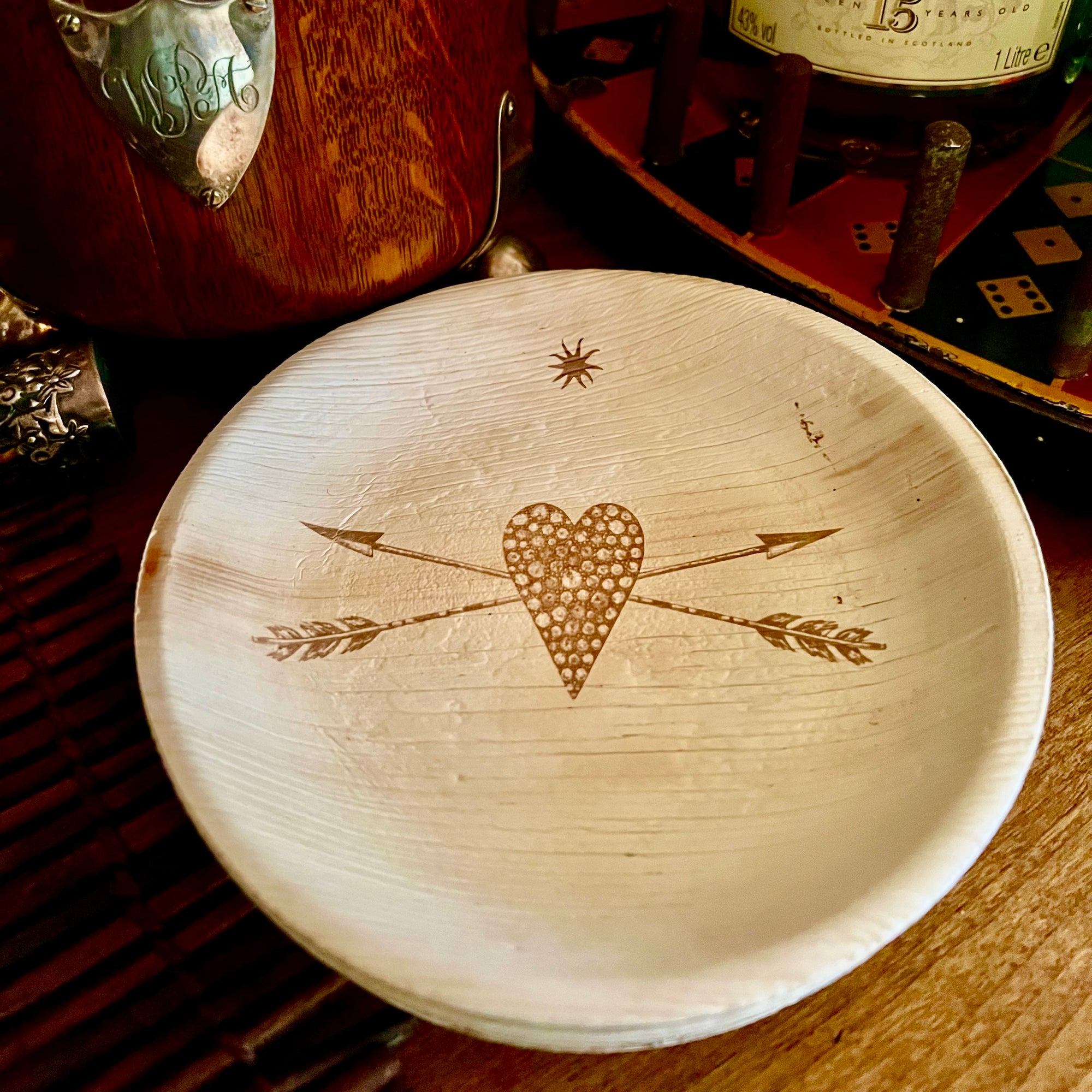 maaterra compostable palm leaf plate with stone heart design.