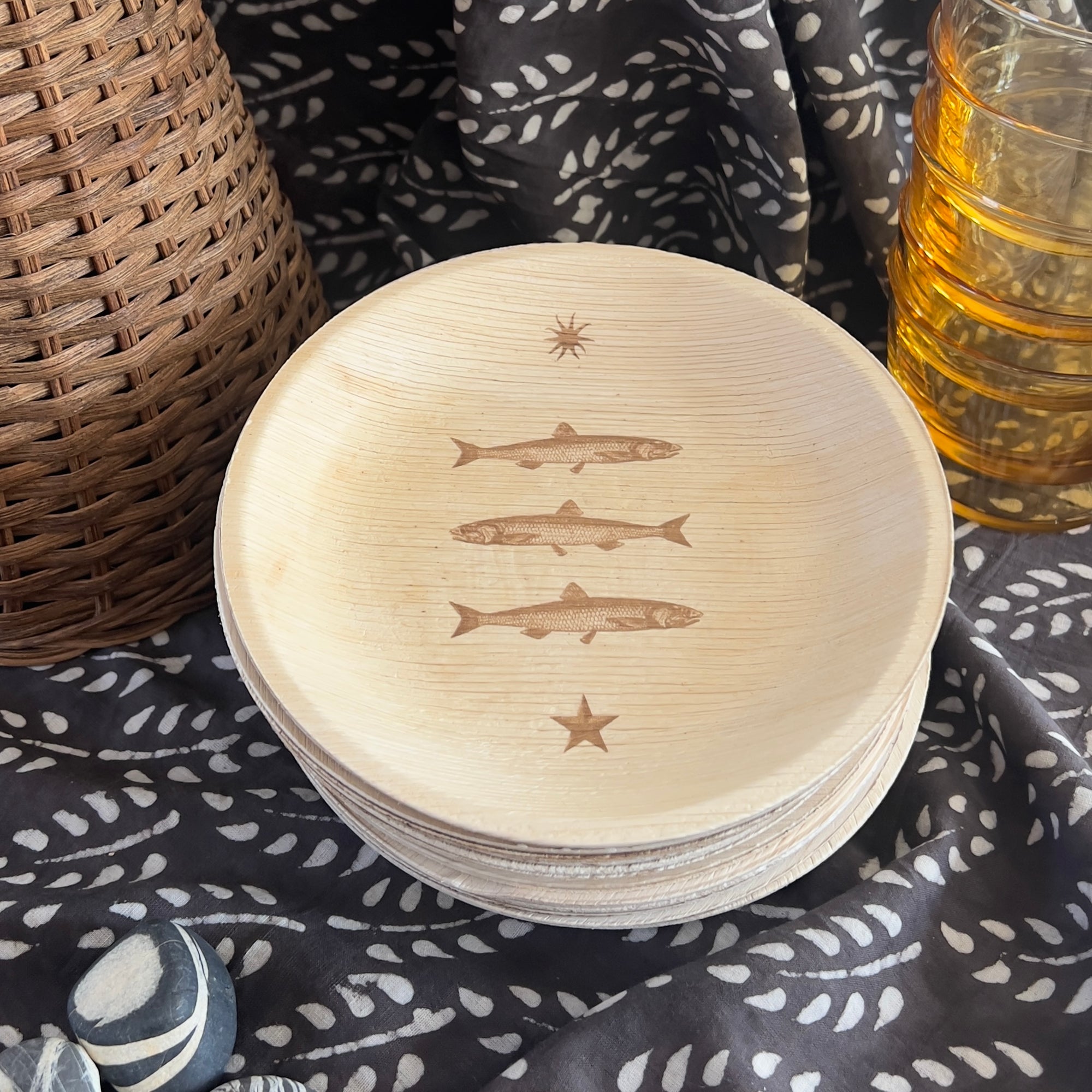 maaterra compostable palm leaf plate with stacked fish design.