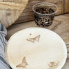 maaterra compostable cup with classic tortoise design on a table setting with maaterra butterfly wreath plate
