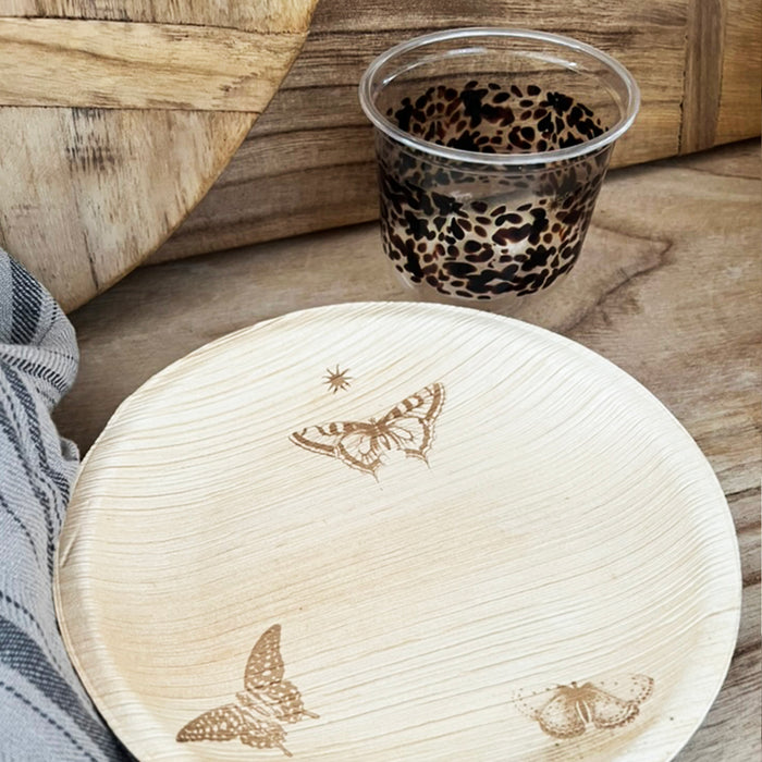 maaterra compostable cup with classic tortoise design on a table setting with maaterra butterfly wreath plate