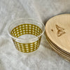 maaterra compostable cup with moss gingham design on a white table cloth