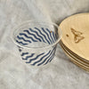 maaterra compostable cup with ocean waves design on white tablecloth