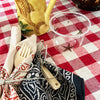 maaterra compostable cup with treasured star design on gingham tablecloth
