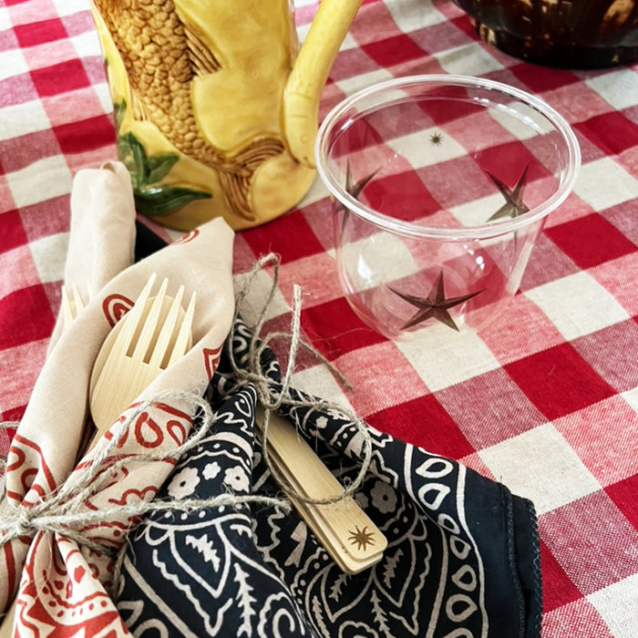 maaterra compostable cup with treasured star design on gingham tablecloth