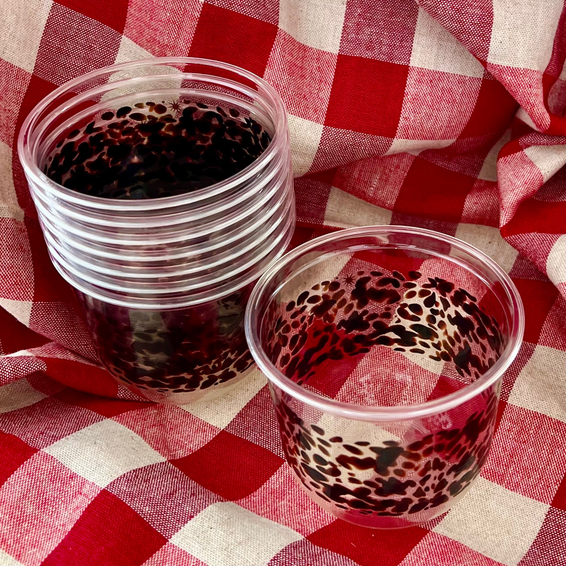 maaterra compostable cups with classic tortoise design on a gingham table setting