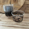 maaterra compostable cups with classic tortoise design on a wooden table