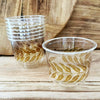 maaterra compostable cups with honey leaves design on a wooden table