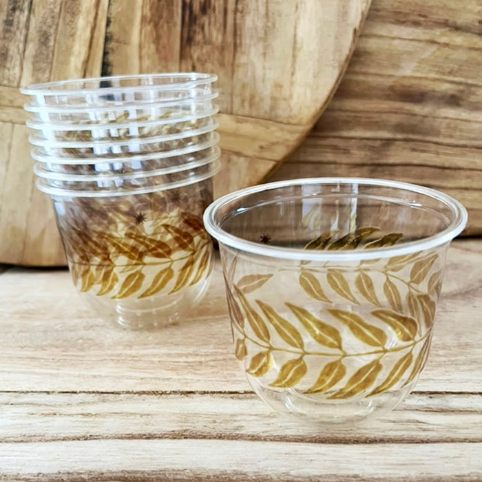 maaterra compostable cups with honey leaves design on a wooden table