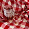maaterra compostable cups with maaterra sun on a gingham tablecloth