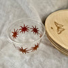 maaterra compostable cups with maaterra sun on a white tablecloth
