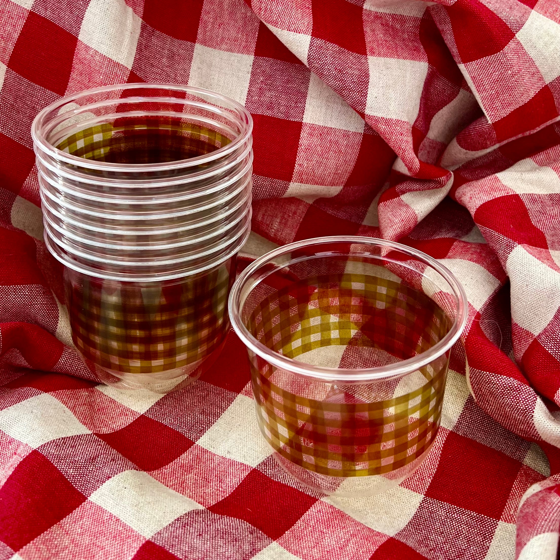 maaterra compostable cups with moss gingham design on a gingham background