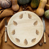 maaterra compostable palm leaf plate with block print wreath design on a red tablecloth with a fall setting