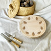 maaterra compostable palm leaf plate with block print wreath design on a white tablecloth