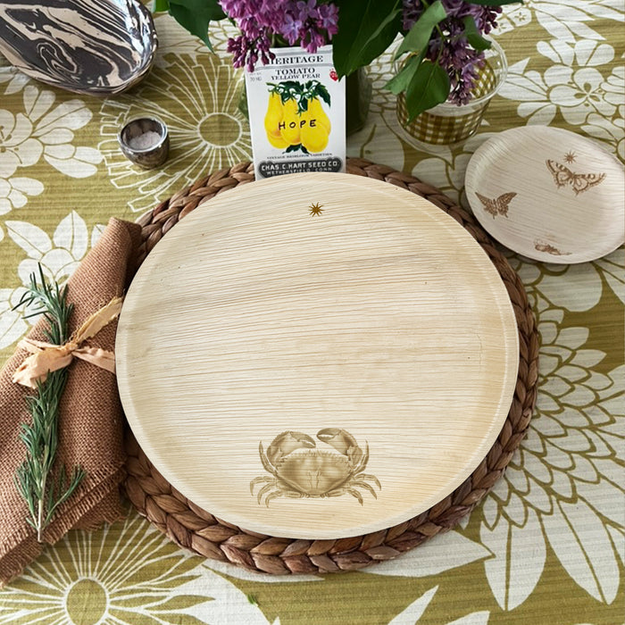 maaterra compostable palm leaf plate with crab design on a flower tablecloth