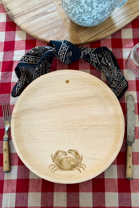 maaterra compostable palm leaf plate with crab design on a gingham tablecloth