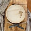 maaterra compostable palm leaf plate with grapes design on a cutting board