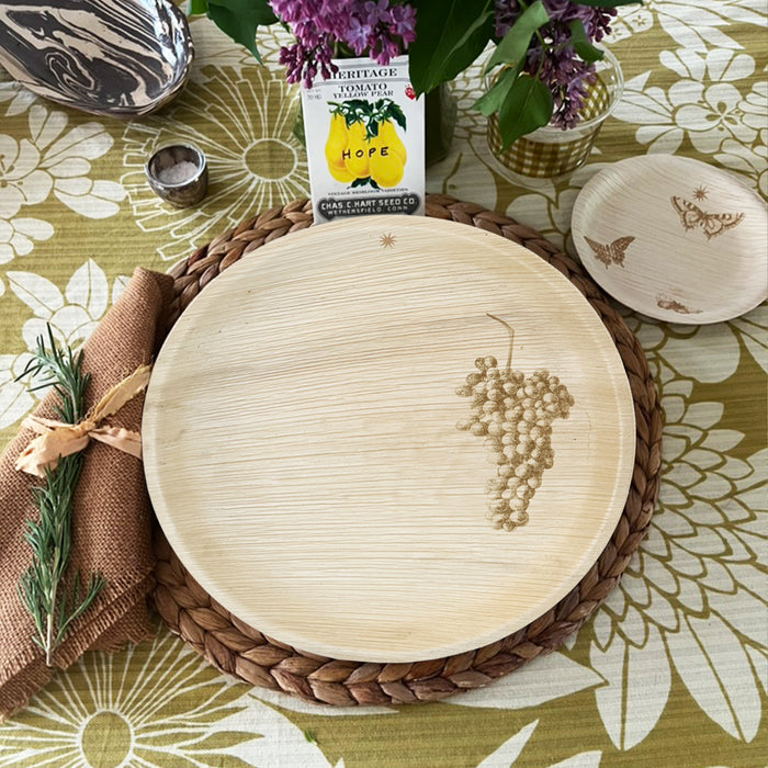 maaterra compostable palm leaf plate with grapes design on a flower