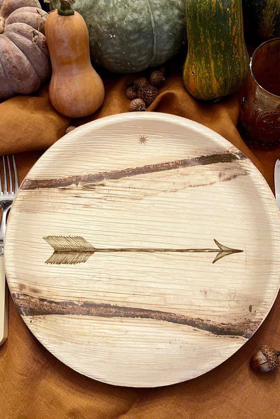 maaterra compostable palm leaf plate with single arrow design on a table setting with fall theme