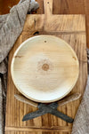 maaterra compostable palm leaf plate with sunflower design on a bread board
