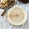 maaterra compostable palm leaf plate with sunflower design on a white tablecloth
