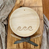 maaterra compostable palm leaf plate with waves design on a bread board