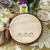 maaterra compostable palm leaf plate with waves design on a flower tablecloth