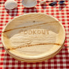 maaterra compostable plate with COOKOUT design on a gingham tablecloth