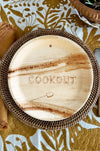 maaterra compostable plate with COOKOUT design on a woven charger