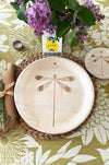maaterra compostable plate with dragonfly design on a flower tablecloth