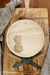 maaterra compostable plate with fresh pineapple design on a bread board