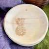 maaterra compostable plate with fresh pineapple design on a purple and green tablecloth