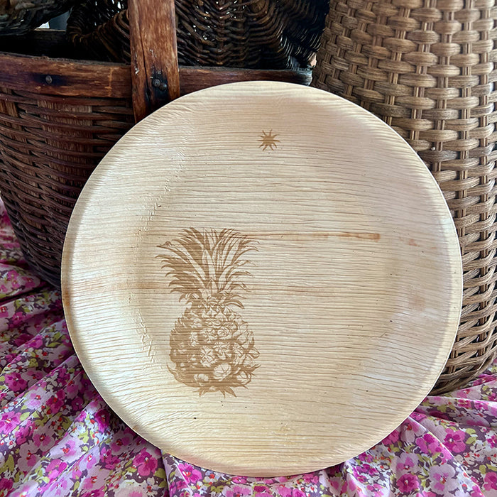 maaterra compostable plate with fresh pineapple design resting on a liberty basket