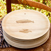 maaterra compostable plate with whale tale design on a chair