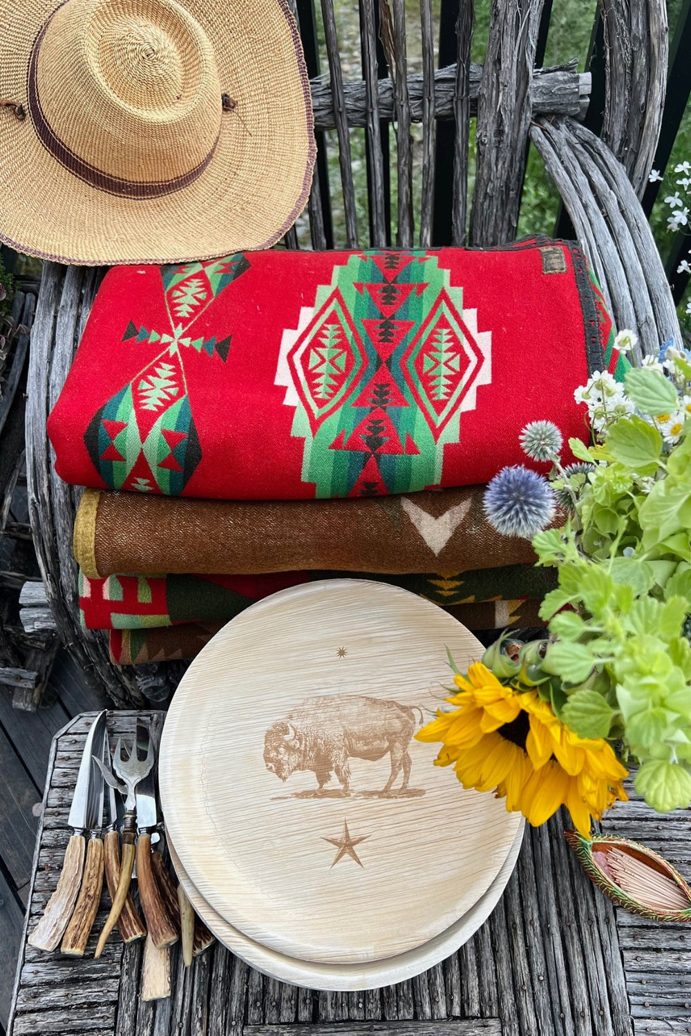 maaterra compostable palm leaf plate pictured in an aerial shot in a western themed photo. 
