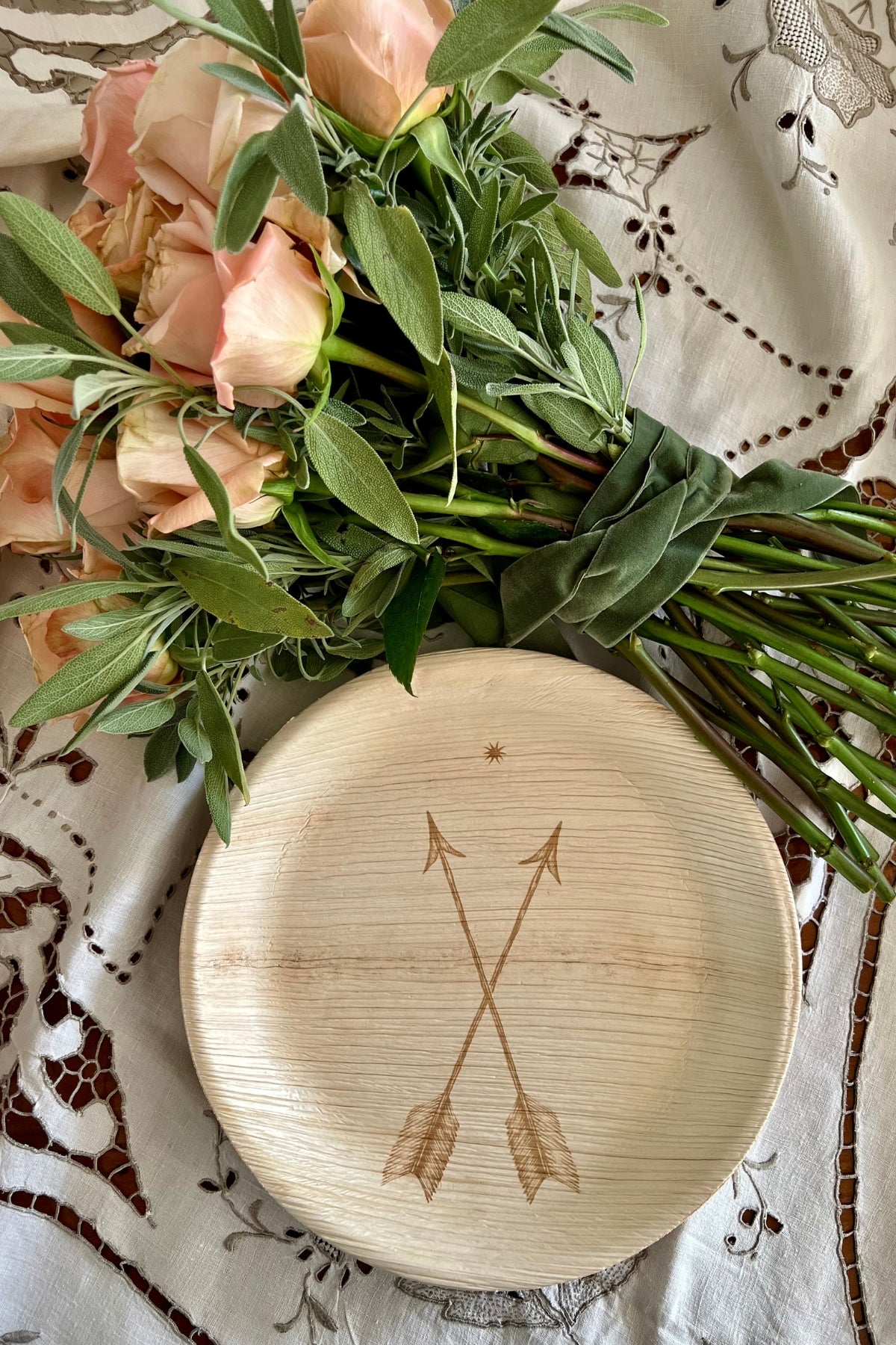 maaterra compostable plate with crossed arrow design. 