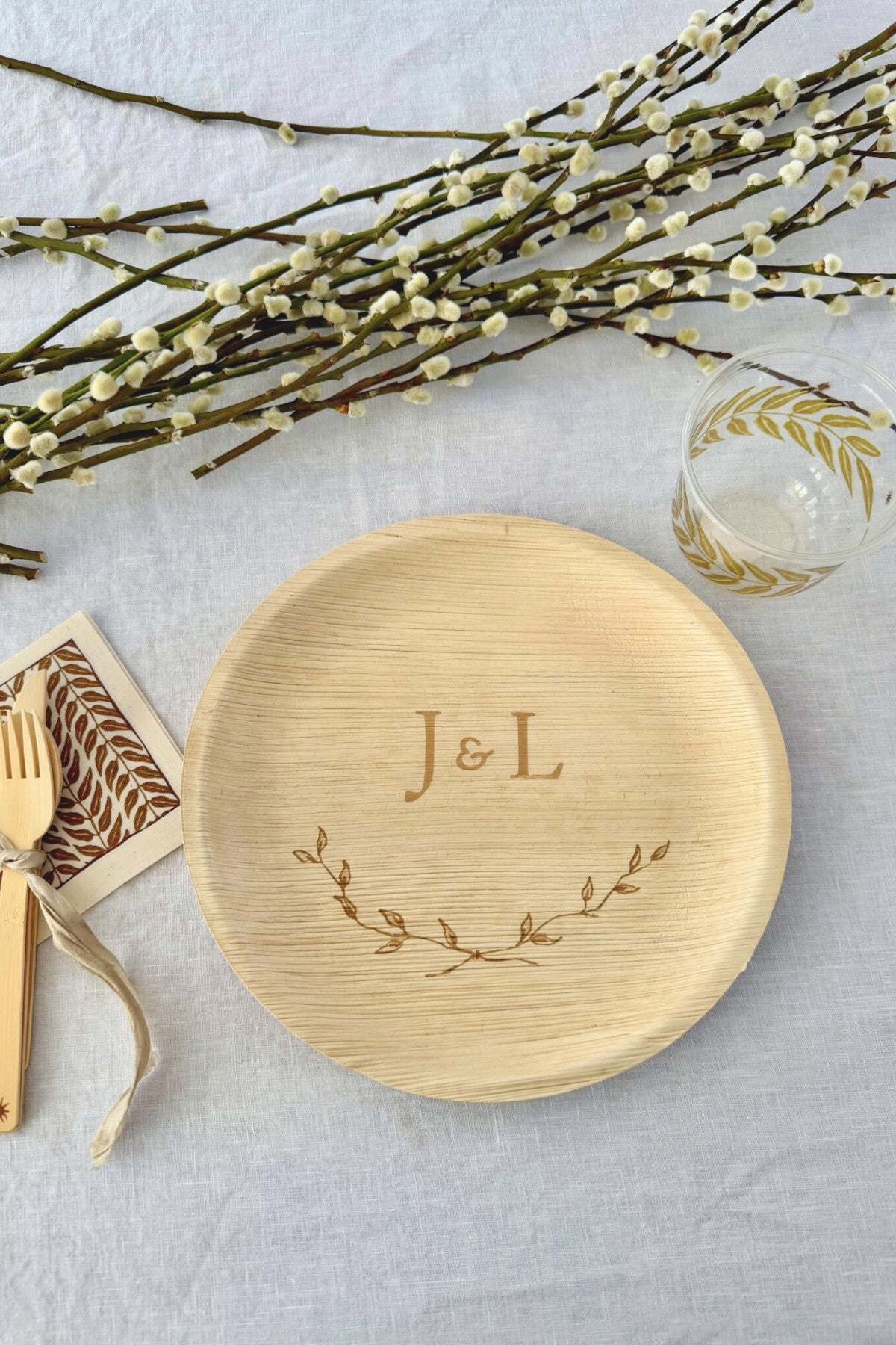maaterra compostable plate with crossed branches design. 