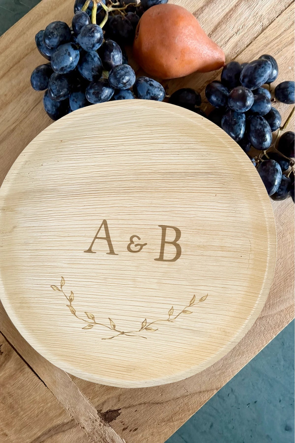 maaterra compostable plate with custom crossed branches design on a breadboard. 