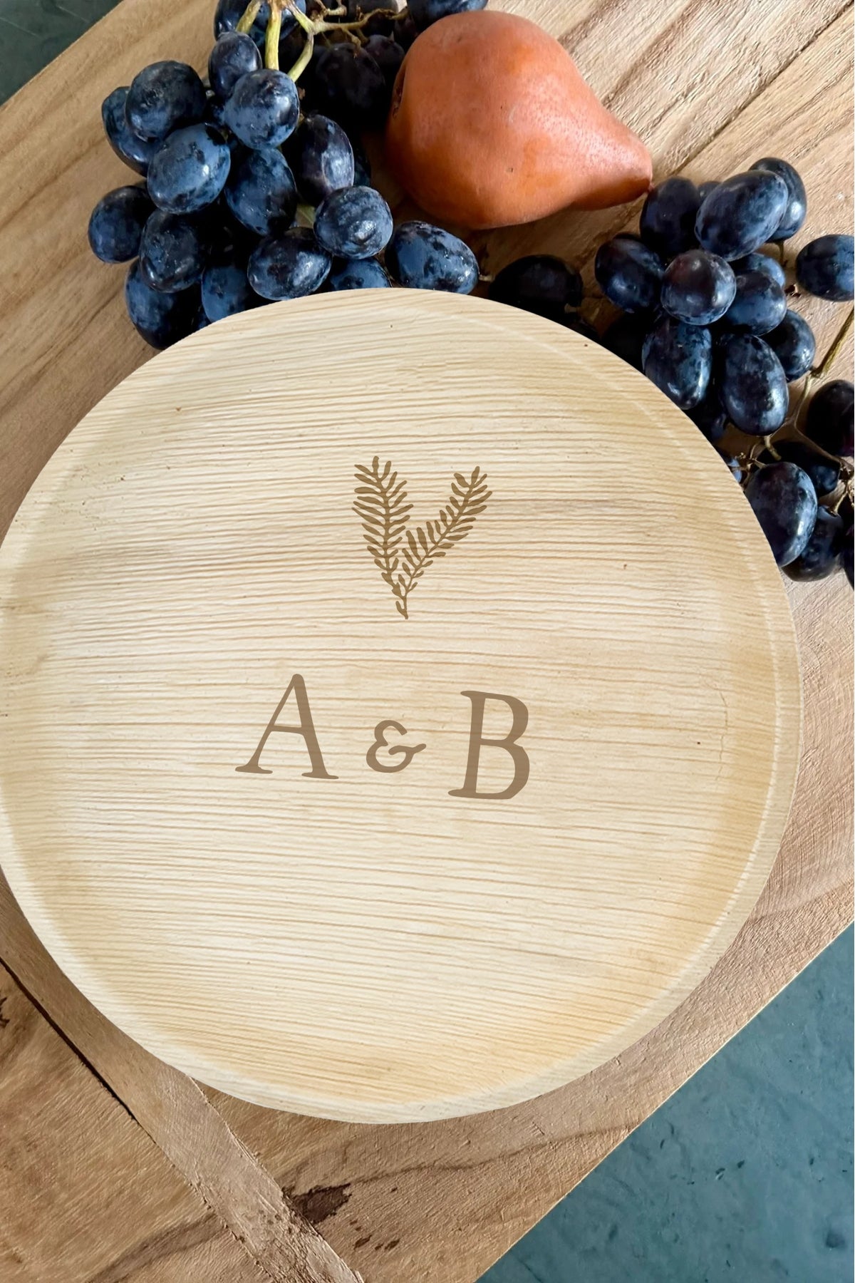 maaterra compostable plate with custom leaf heart design on a breadboard. 